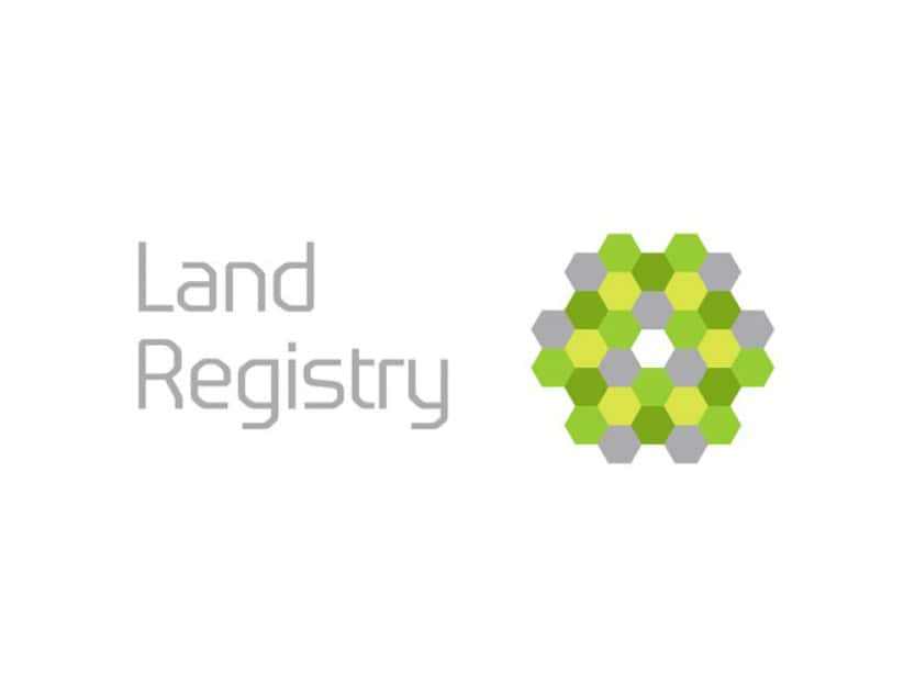 Land Registry logo featuring a stylized hexagonal pattern in shades of green and gray to the right of the text, reflecting its connection with government operations.
