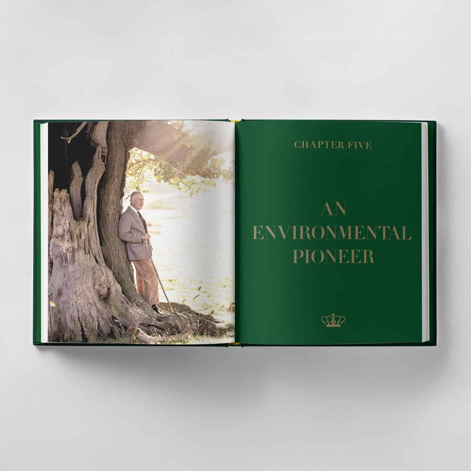 Open book displaying King Charles III leaning against a large tree on the left page, with the title "Chapter Five: An Environmental Pioneer" elegantly scripted in gold text on the right page.