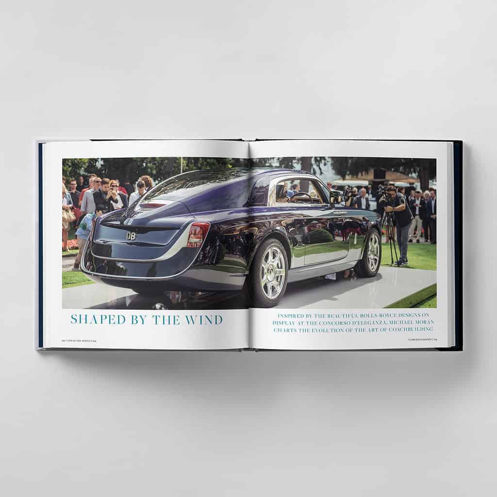 Open book displaying a luxury car on the left page with people in the background. The text reads "Shaped by the Wind," embodying perfection as we continually strive for excellence.