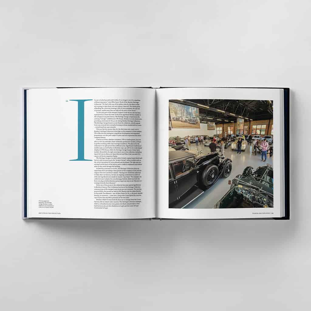 Open book revealing a photo of a car exhibition where people strive for perfection, admiring vintage automobiles in all their splendor.